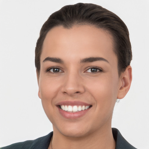 Joyful white young-adult female with short  brown hair and brown eyes