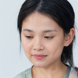 Joyful asian young-adult female with medium  brown hair and brown eyes