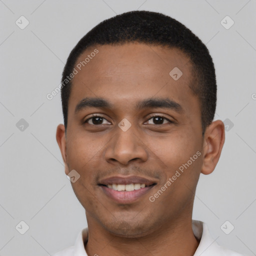 Joyful black young-adult male with short  black hair and brown eyes