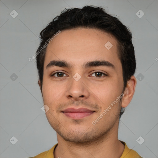 Joyful white young-adult male with short  black hair and brown eyes