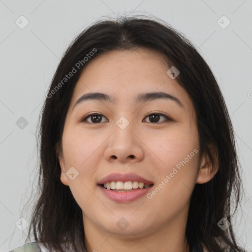 Joyful asian young-adult female with long  brown hair and brown eyes