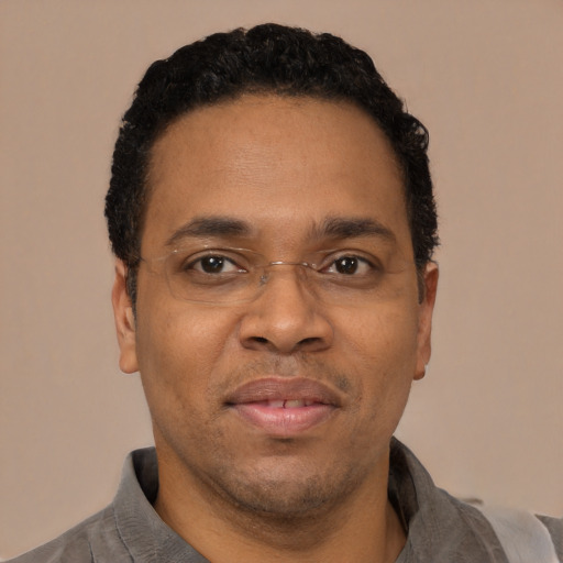 Neutral latino adult male with short  brown hair and brown eyes