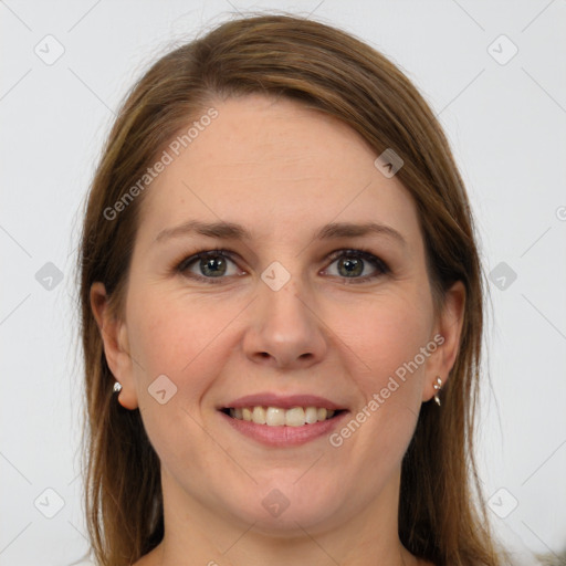 Joyful white young-adult female with long  brown hair and grey eyes