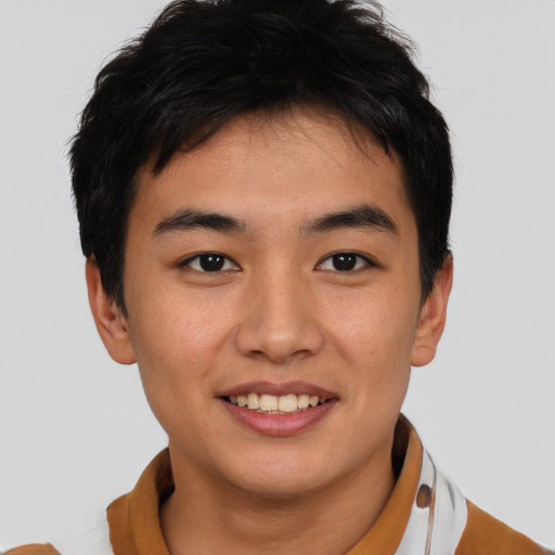 Joyful asian young-adult male with short  brown hair and brown eyes