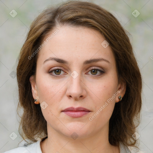 Joyful white young-adult female with medium  brown hair and green eyes