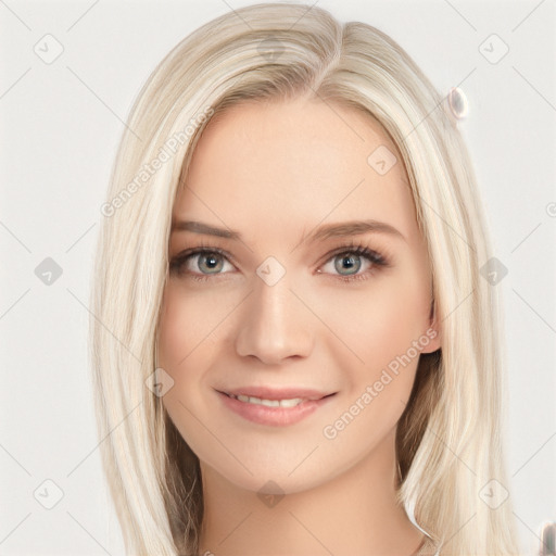 Joyful white young-adult female with long  brown hair and blue eyes