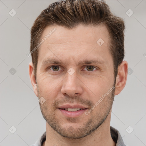 Joyful white adult male with short  brown hair and grey eyes