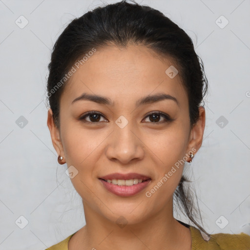 Joyful latino young-adult female with short  brown hair and brown eyes