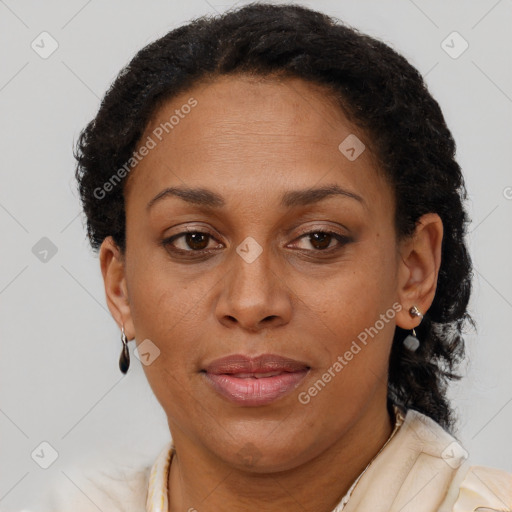 Joyful latino adult female with short  brown hair and brown eyes