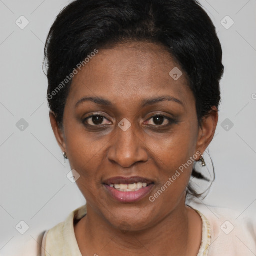 Joyful black adult female with short  black hair and brown eyes
