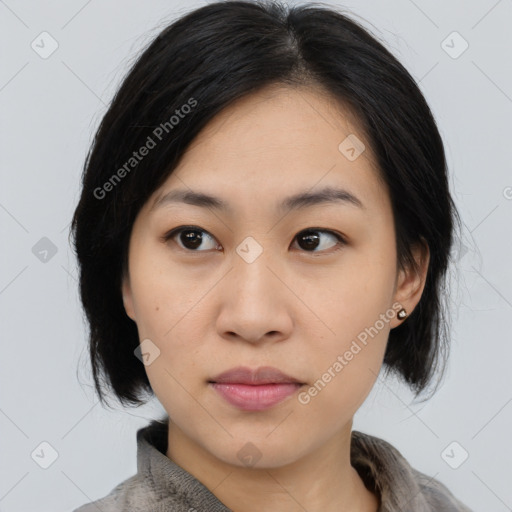 Joyful asian young-adult female with medium  black hair and brown eyes