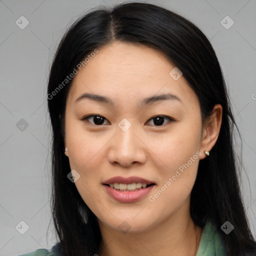 Joyful asian young-adult female with long  brown hair and brown eyes