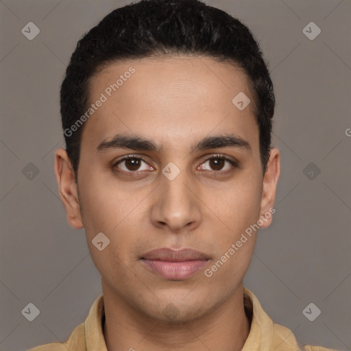 Joyful latino young-adult male with short  brown hair and brown eyes