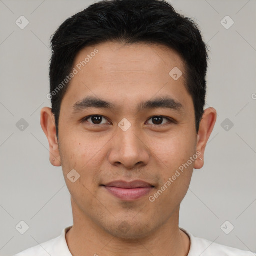 Joyful asian young-adult male with short  brown hair and brown eyes