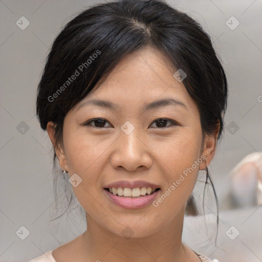 Joyful asian young-adult female with medium  brown hair and brown eyes