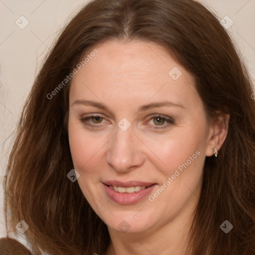 Joyful white adult female with long  brown hair and brown eyes