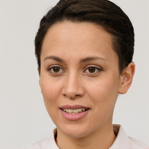 Joyful white young-adult female with short  brown hair and brown eyes