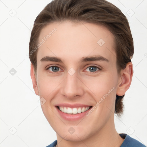 Joyful white young-adult female with short  brown hair and grey eyes