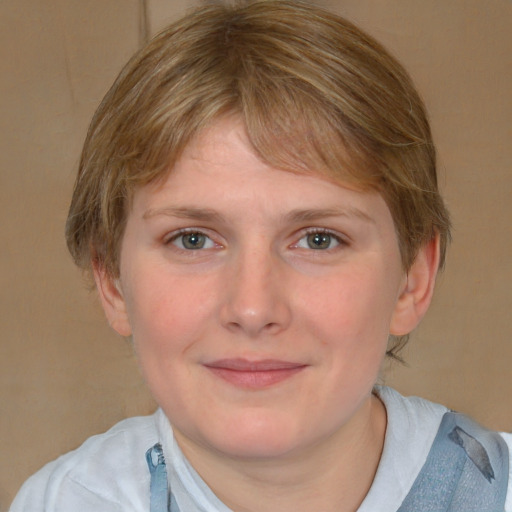 Joyful white young-adult female with medium  brown hair and blue eyes