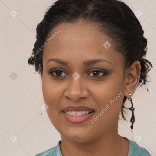 Joyful black young-adult female with long  brown hair and brown eyes