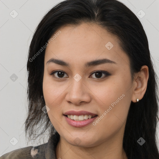 Joyful latino young-adult female with long  brown hair and brown eyes