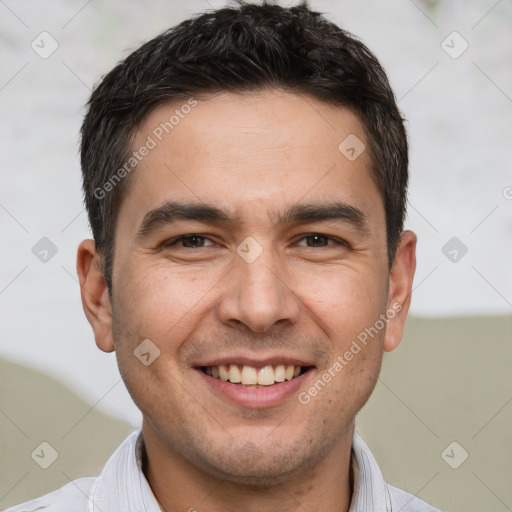 Joyful white young-adult male with short  brown hair and brown eyes