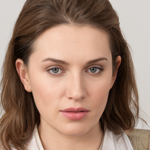 Neutral white young-adult female with medium  brown hair and grey eyes