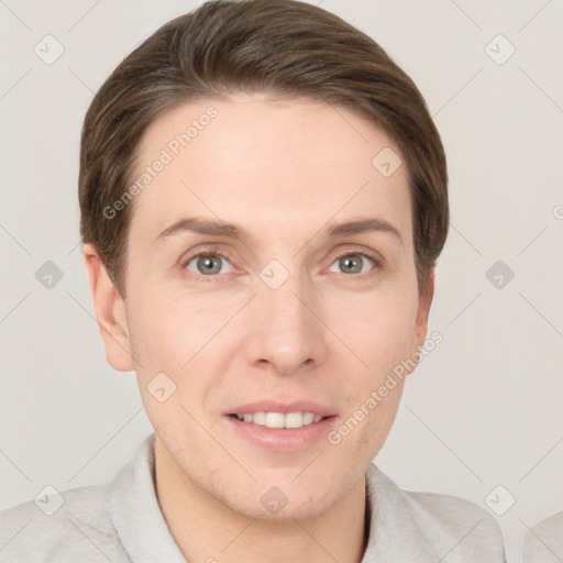 Joyful white young-adult female with short  brown hair and grey eyes