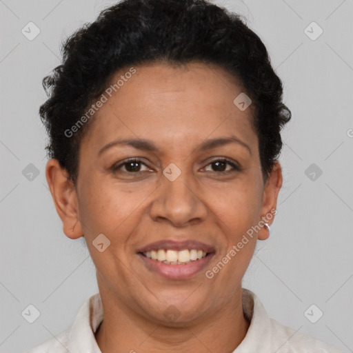 Joyful latino adult female with short  brown hair and brown eyes