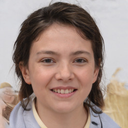 Joyful white child female with medium  brown hair and brown eyes