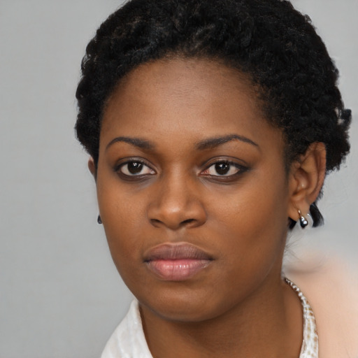 Neutral black young-adult female with short  black hair and brown eyes