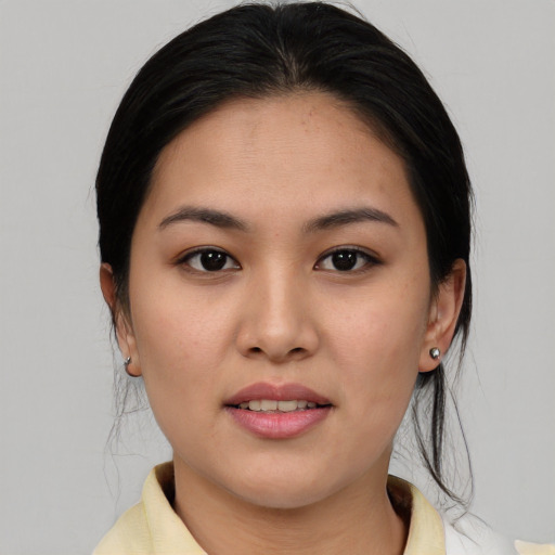 Joyful asian young-adult female with medium  brown hair and brown eyes