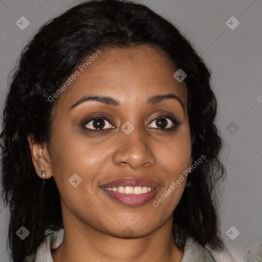 Joyful black young-adult female with long  brown hair and brown eyes