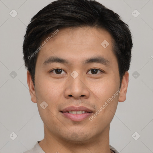 Joyful asian young-adult male with short  brown hair and brown eyes