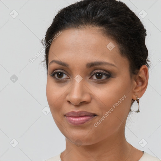 Joyful latino young-adult female with short  brown hair and brown eyes