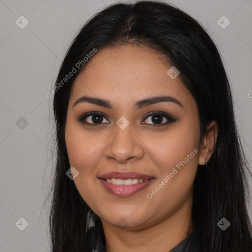 Joyful latino young-adult female with long  brown hair and brown eyes