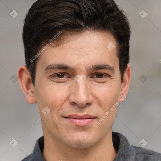 Joyful white adult male with short  brown hair and brown eyes