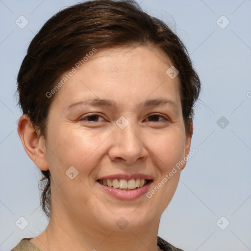 Joyful white adult female with short  brown hair and brown eyes