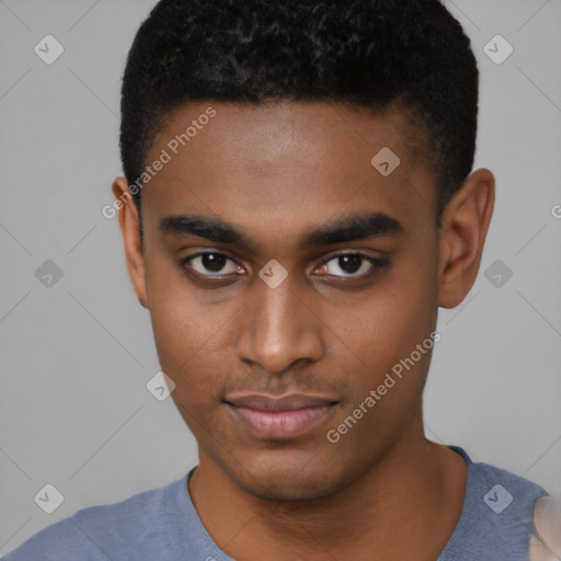 Joyful black young-adult male with short  black hair and brown eyes