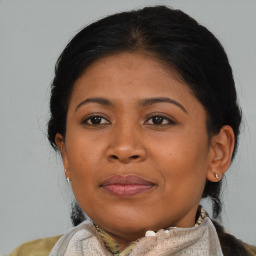 Joyful asian young-adult female with medium  brown hair and brown eyes