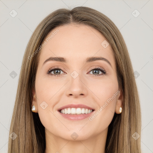 Joyful white young-adult female with long  brown hair and green eyes