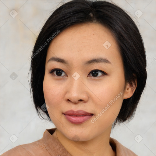 Joyful asian young-adult female with medium  black hair and brown eyes