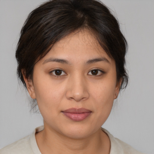 Joyful white young-adult female with medium  brown hair and brown eyes