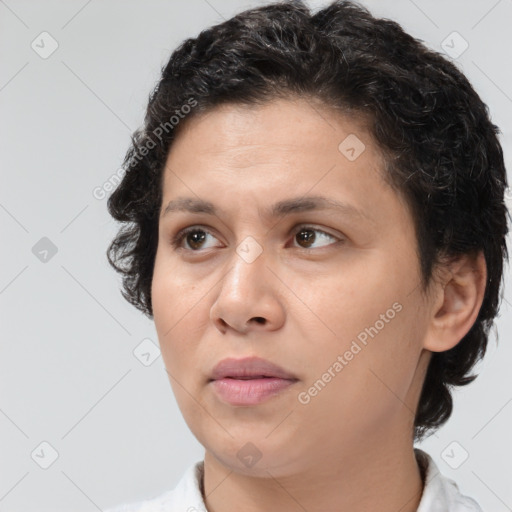 Joyful white adult female with short  brown hair and brown eyes