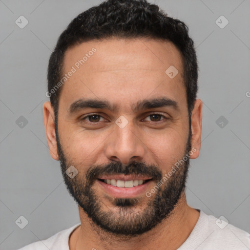 Joyful white young-adult male with short  black hair and brown eyes