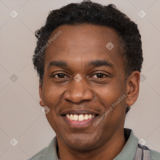 Joyful latino adult male with short  black hair and brown eyes
