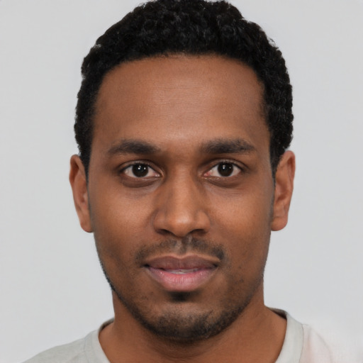 Neutral black young-adult male with short  black hair and brown eyes