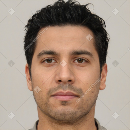 Neutral white young-adult male with short  black hair and brown eyes