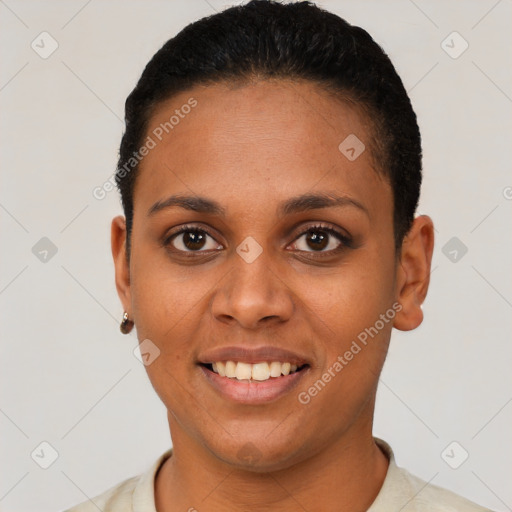 Joyful black young-adult female with short  black hair and brown eyes