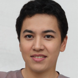 Joyful asian young-adult male with short  black hair and brown eyes